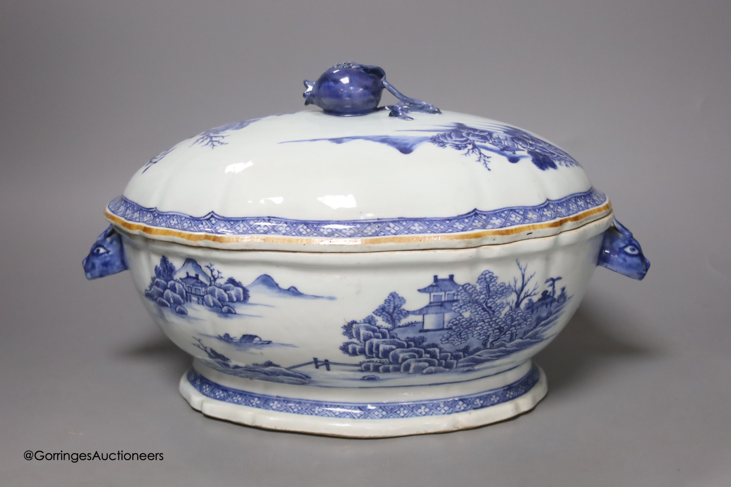 A 18th century Chinese export blue and white tureen and cover pomegranate finial, length 35cm